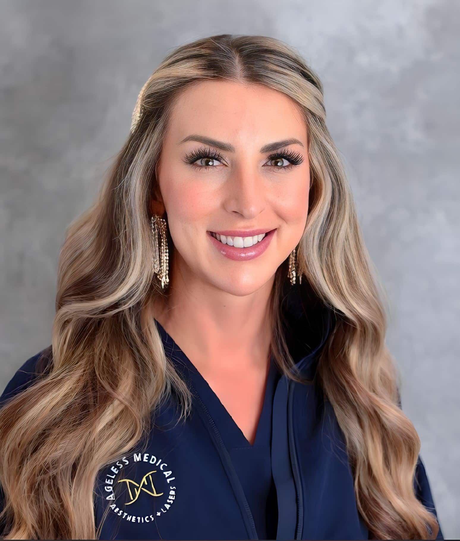 a woman with long hair wearing a blue shirt