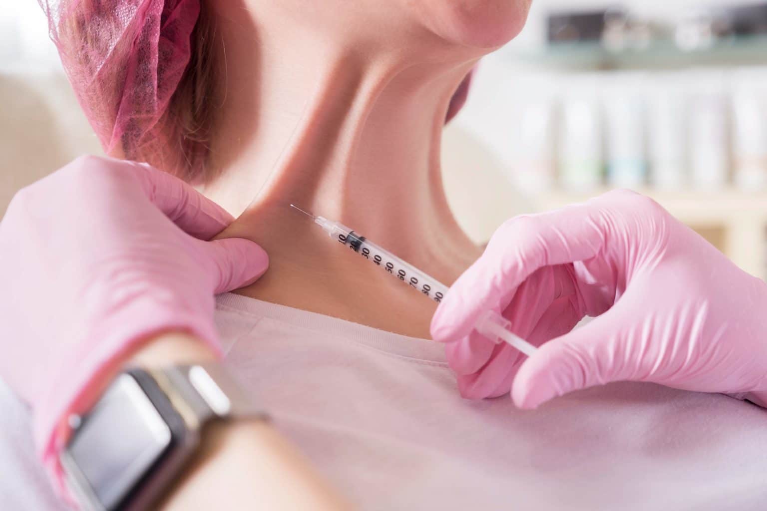 Female getting injection over neck | Kybella Services | AgeLess Medical Aesthetics in Cheyenne, WY