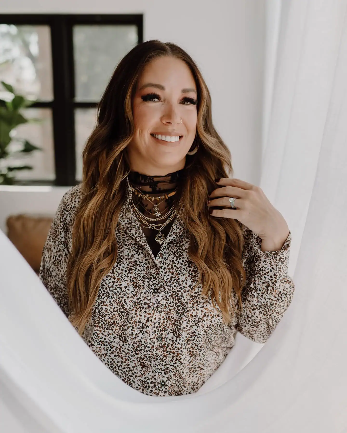 a woman smiling with long hair